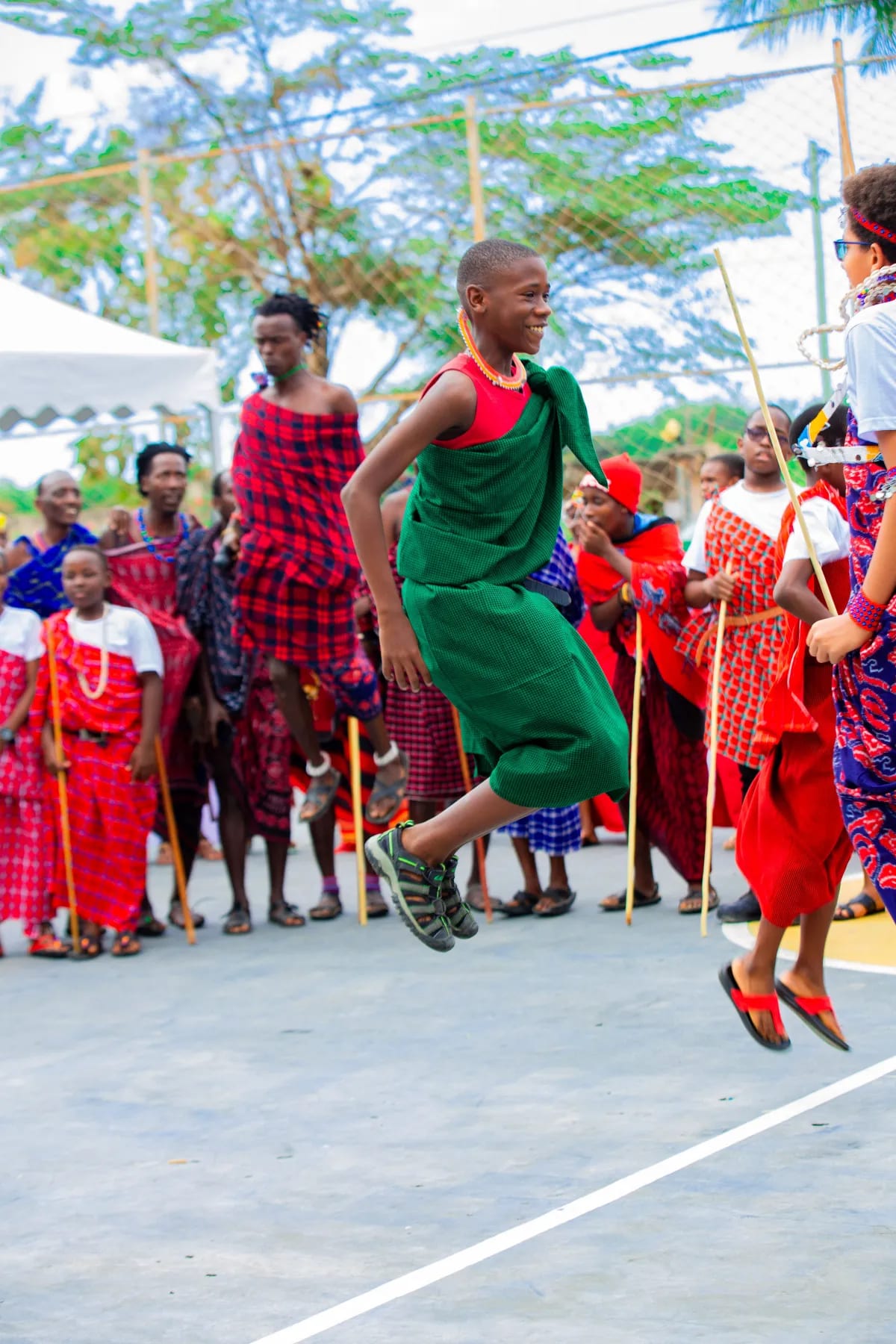 A pupil performing a traditional jumping dance