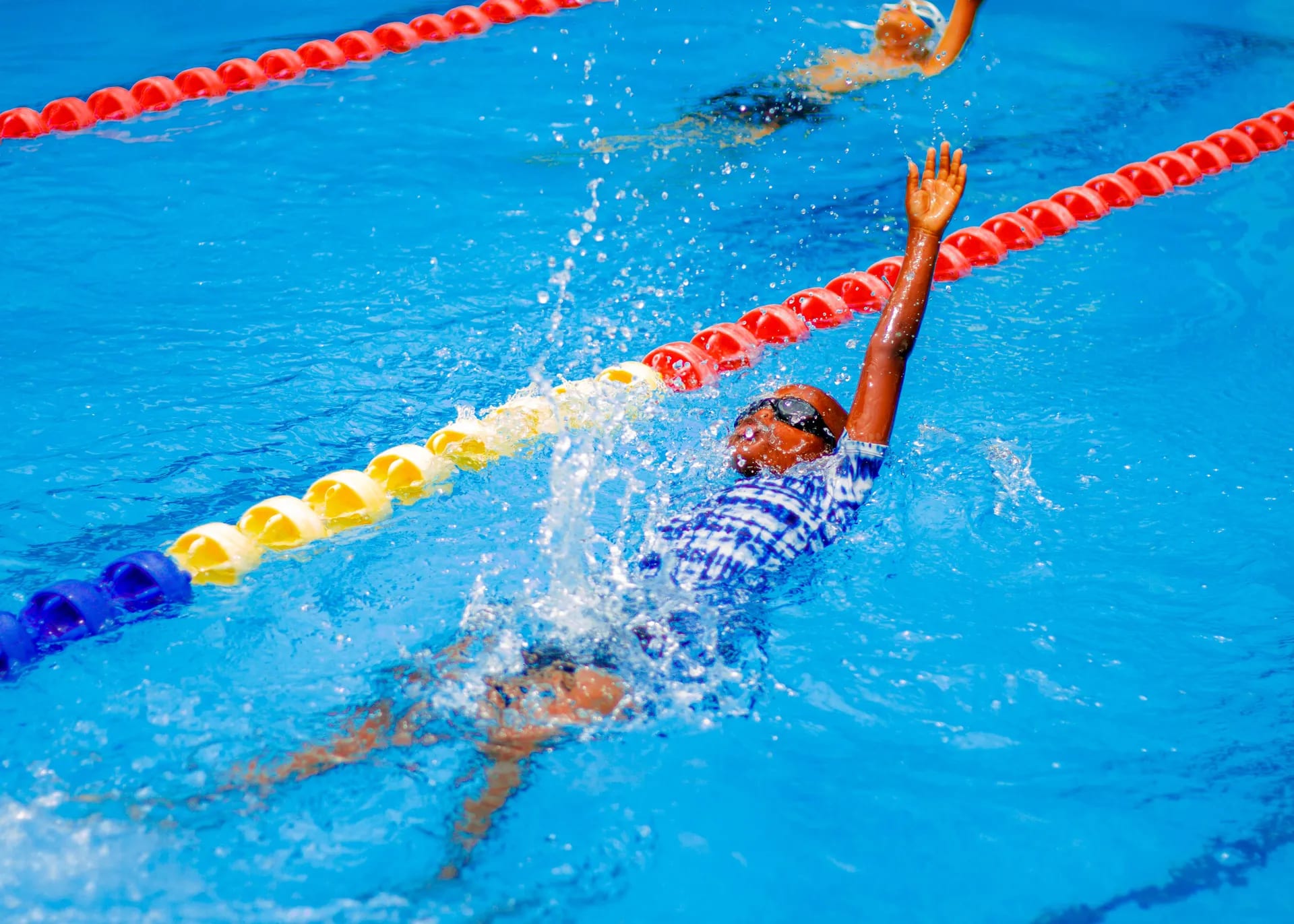 A strong finish in the backstroke race.