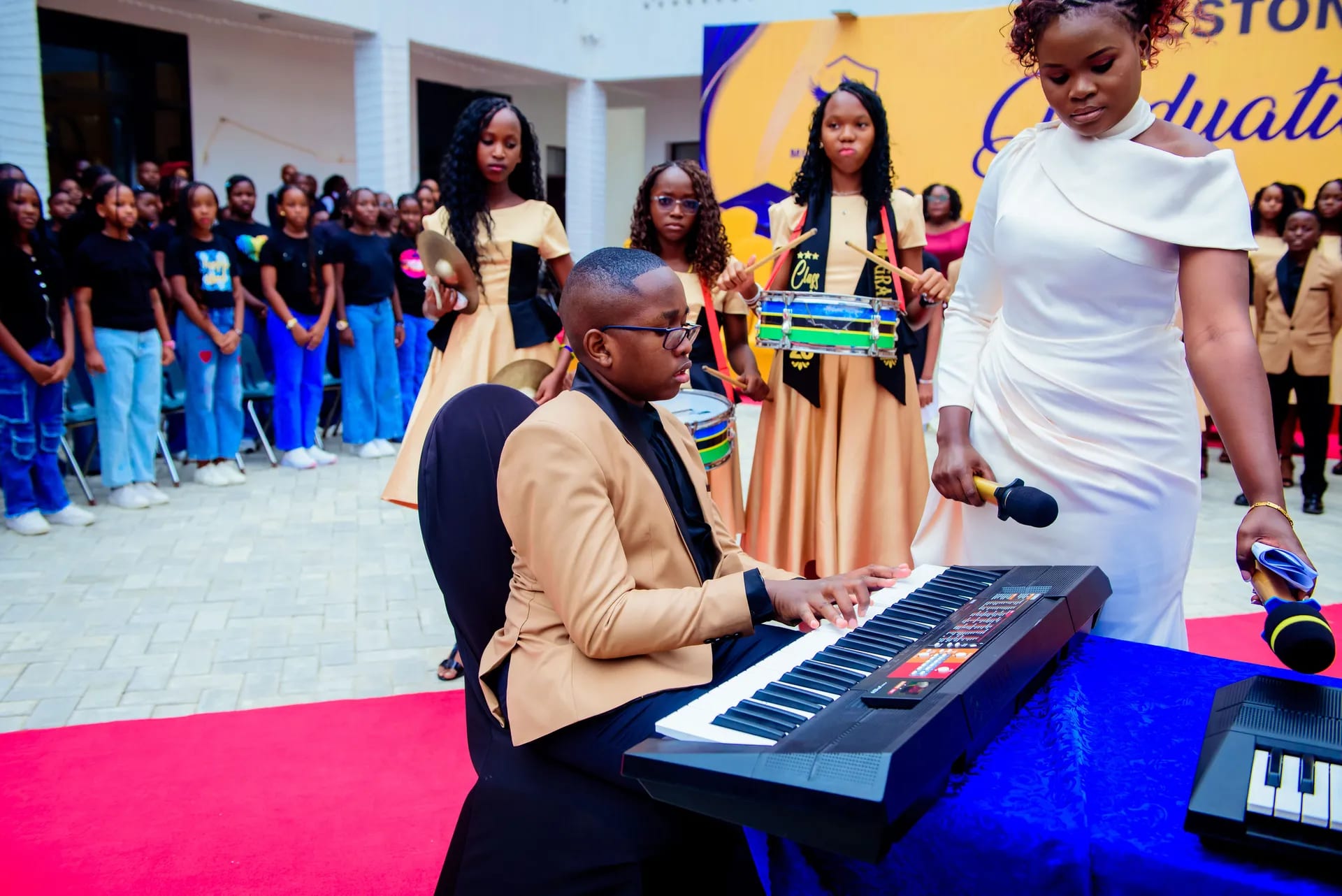 Graduates performing music for the audience.