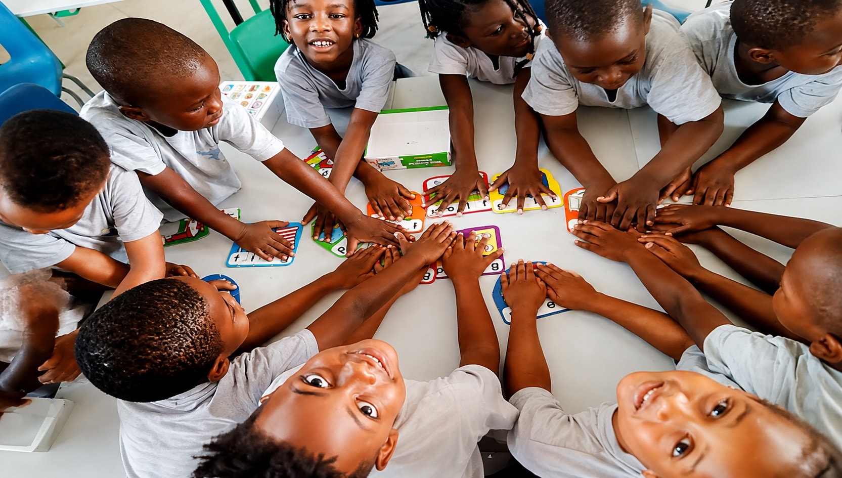 Pupils collaborating during a classroom activity at Milestones Academy